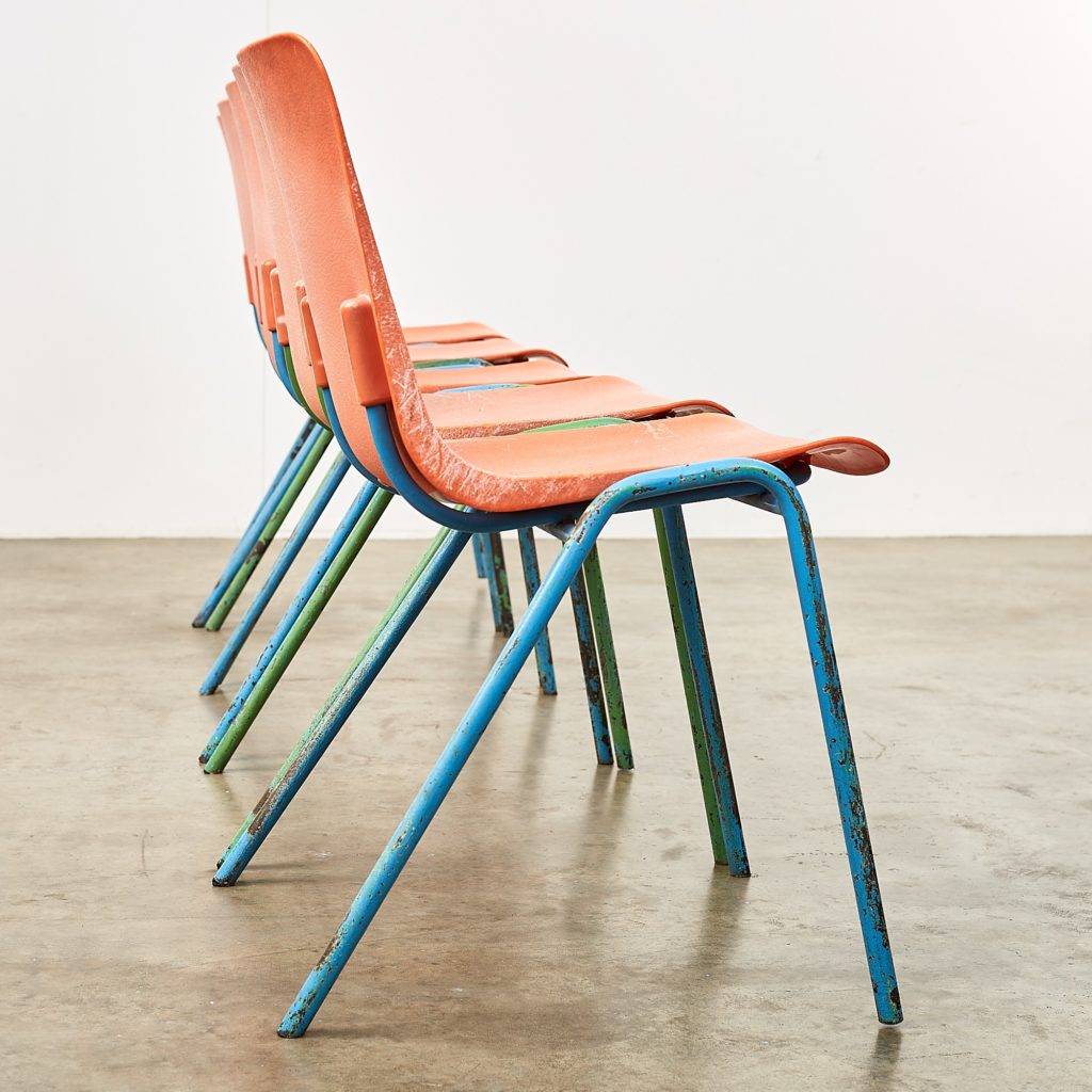 Distressed orange school chairs,-107479