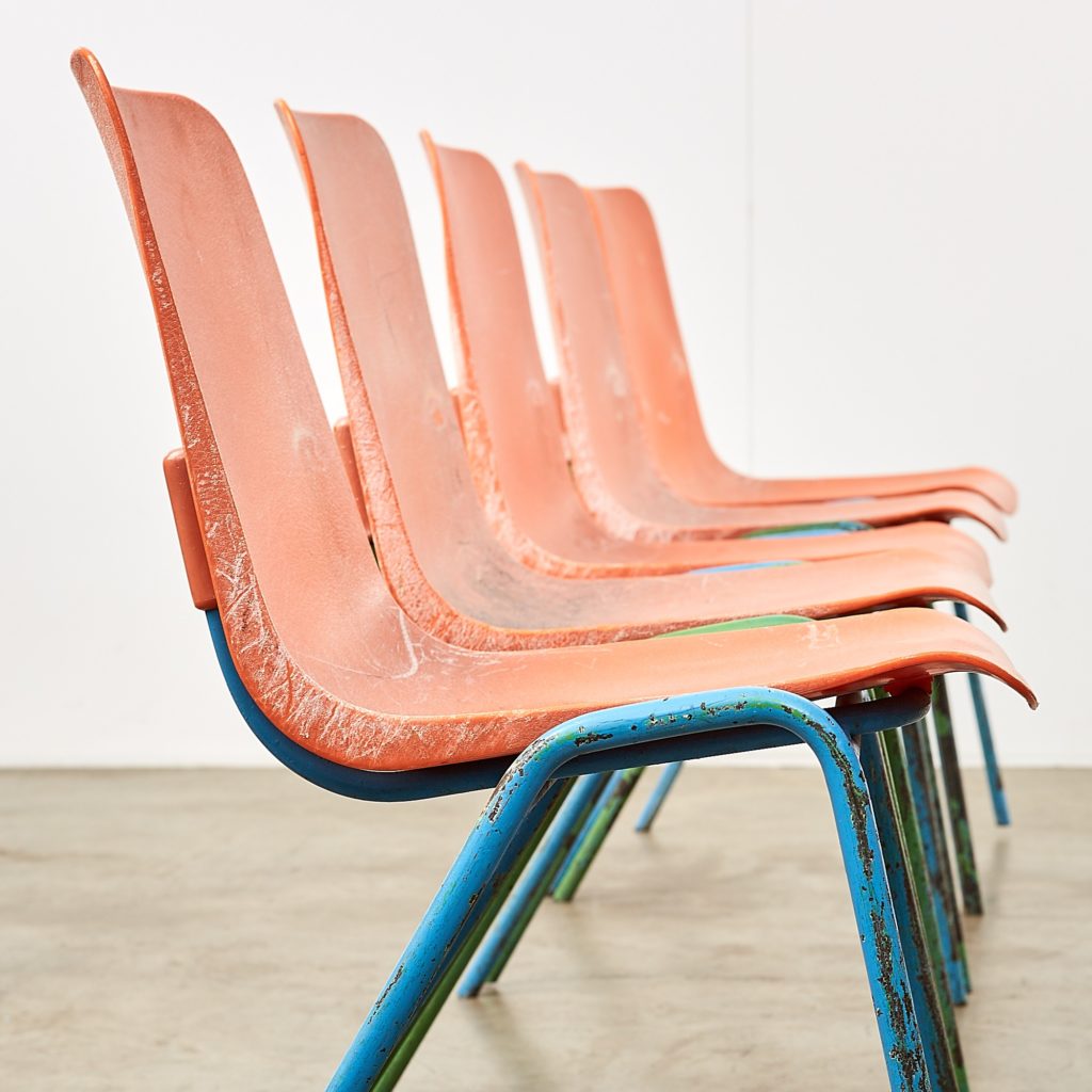 Distressed orange school chairs,-107472