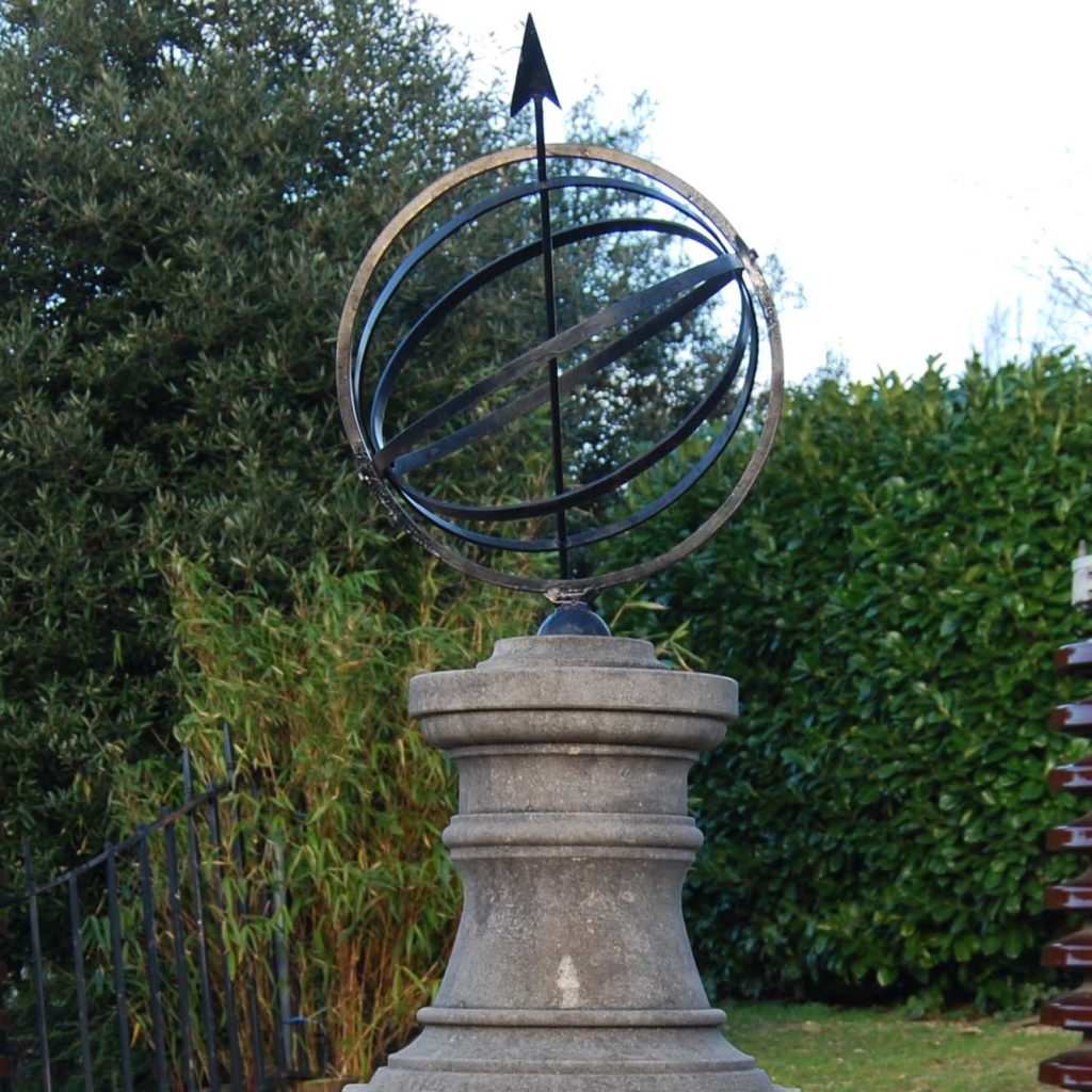 A carved limestone sundial pedestal and steel armillary sphere-111449