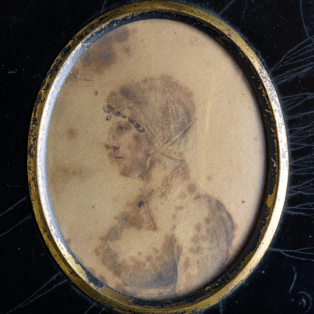 Oval portrait miniature of a lady wearing a bonnet-113210