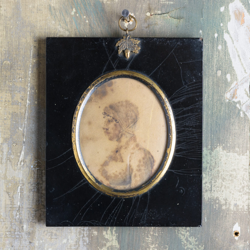 Oval portrait miniature of a lady wearing a bonnet-0