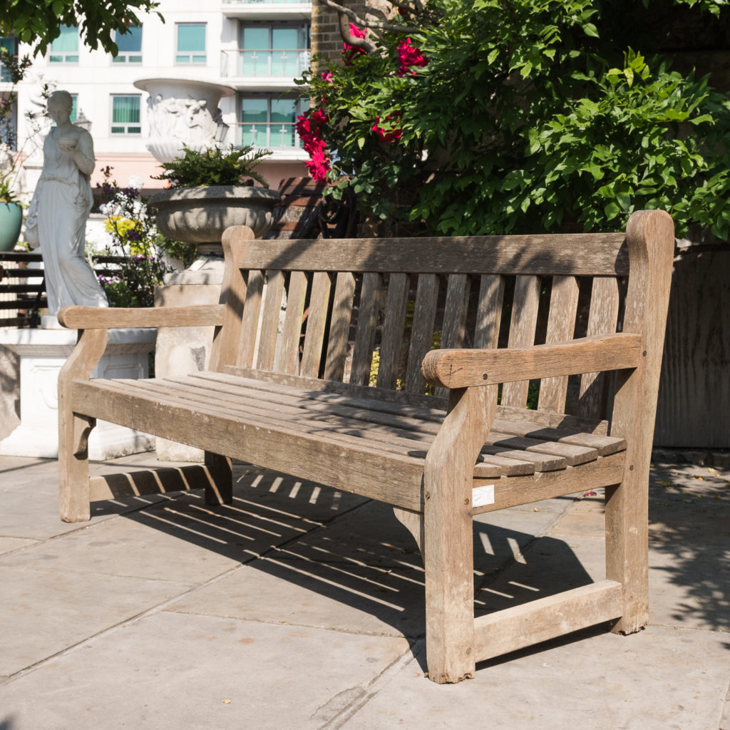 A weathered teak bench,-0