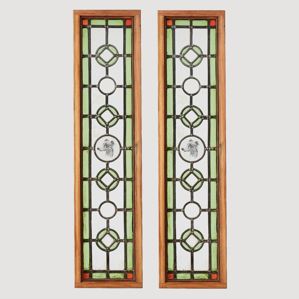 A pair of stained glass panels,-0