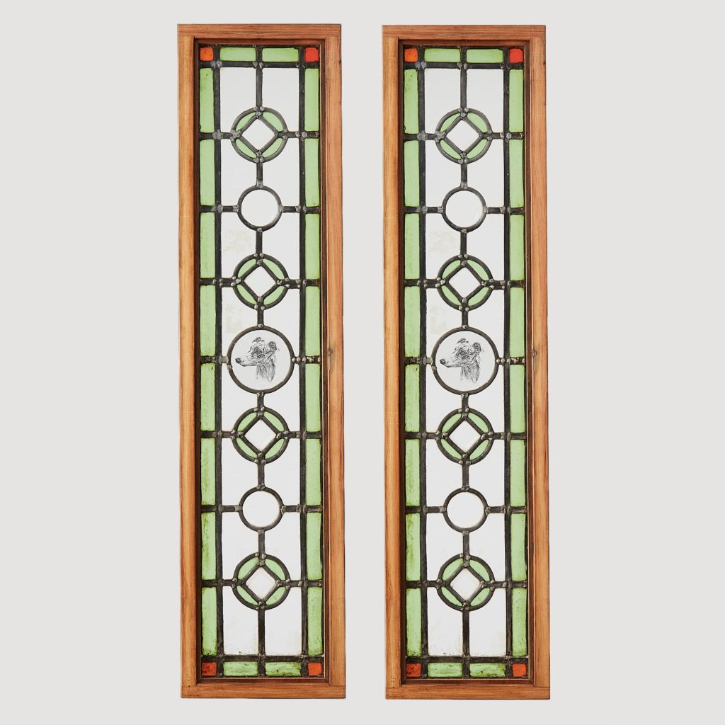 A pair of stained glass panels,-0