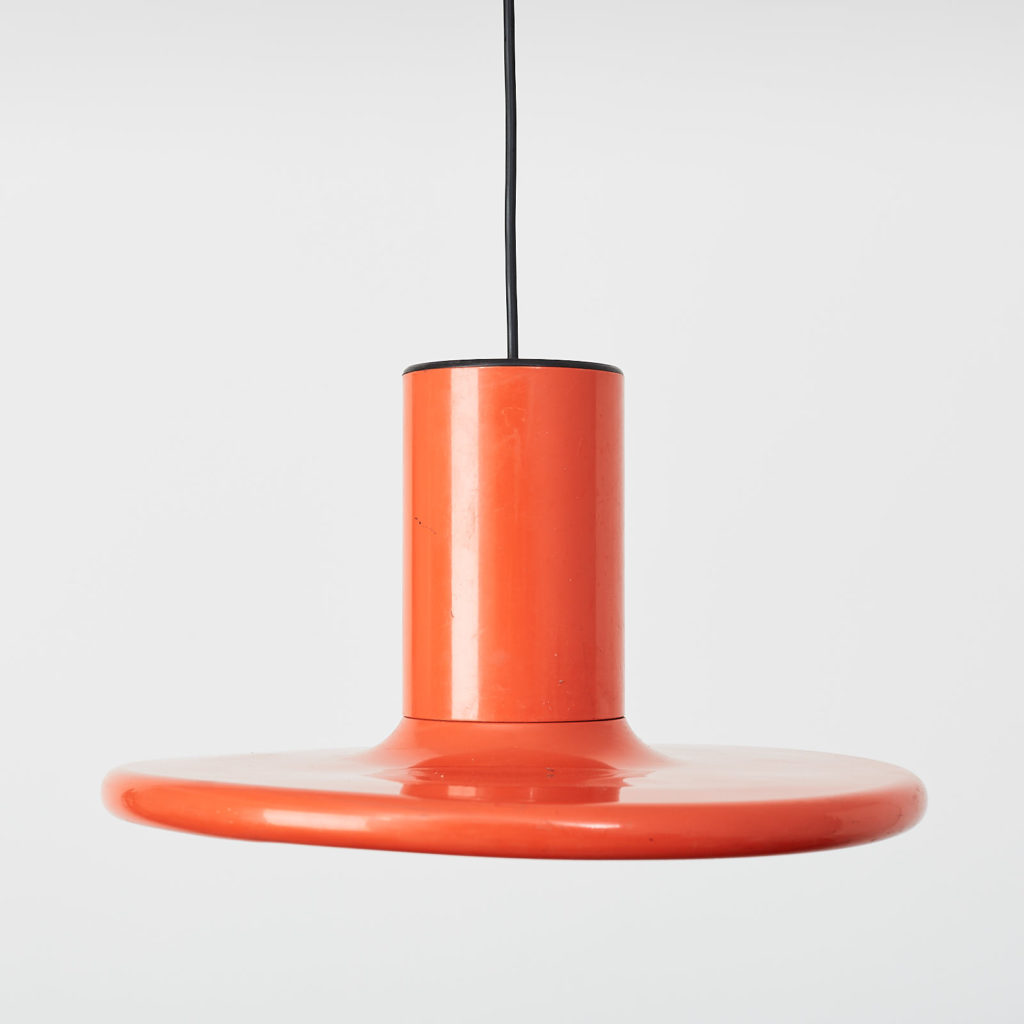 A pair of orange pendant lights by LITA,-121627