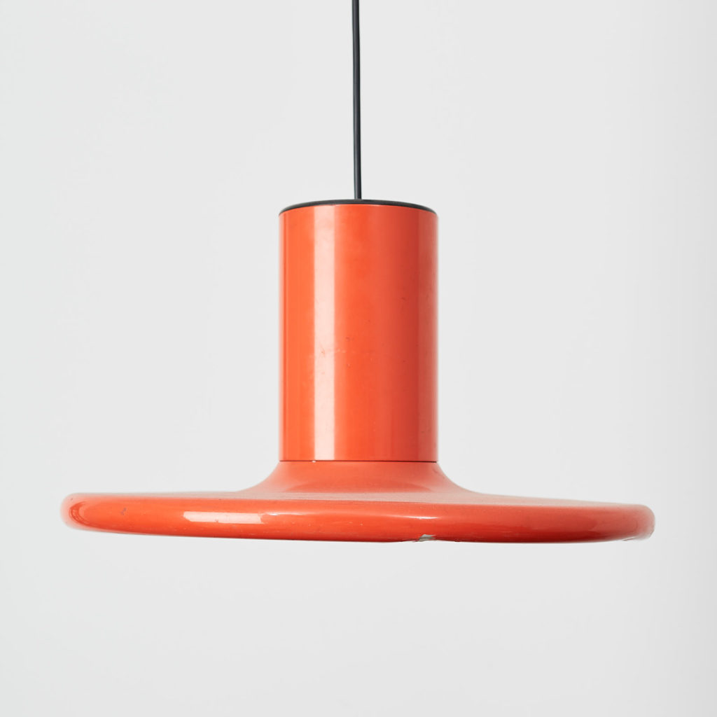 A pair of orange pendant lights by LITA,-121628