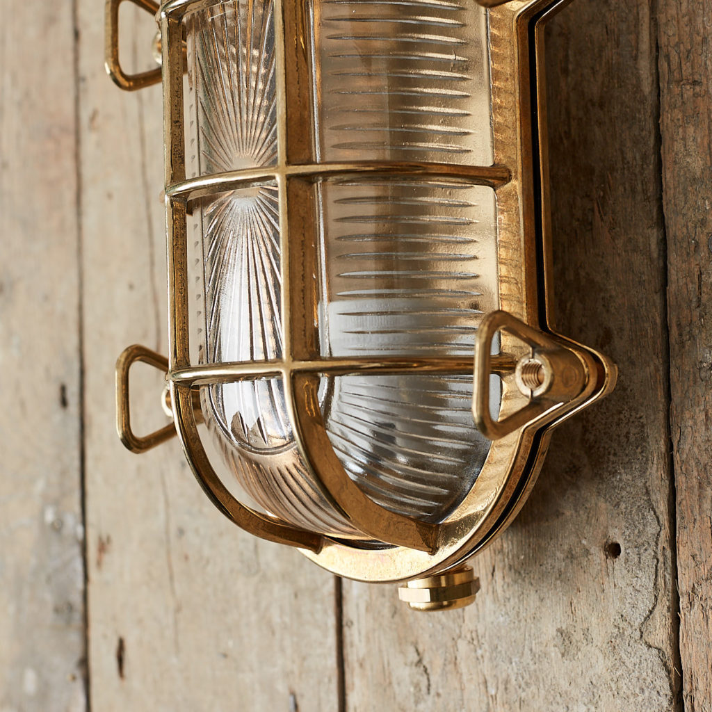 A polished brass bulkhead light,-121538