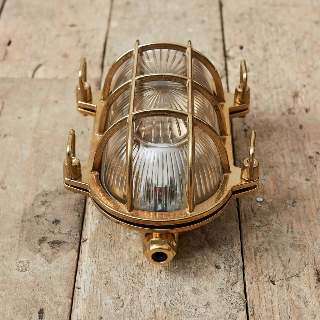 A polished brass bulkhead light,-121541