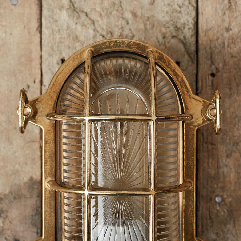 A polished brass bulkhead light,-121539