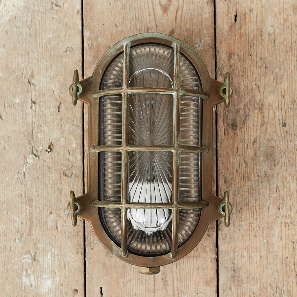 An aged brass bulkhead light,-0