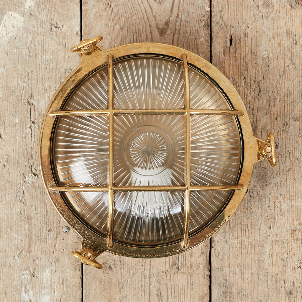 A round polished brass bulkhead light,-0