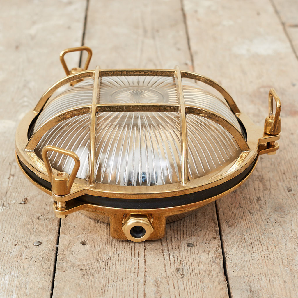 A round polished brass bulkhead light,-121579
