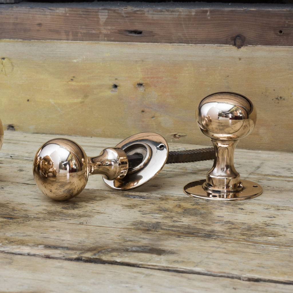 Early twentieth century rose brass door knobs,-0