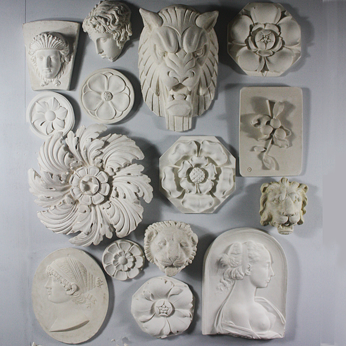 A cast plaster flowerhead roundel,-122957