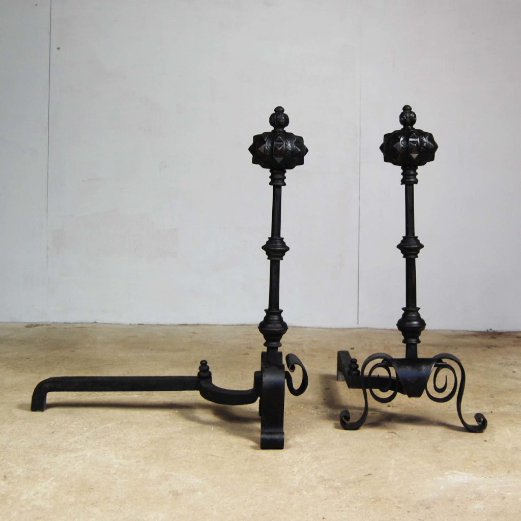 A pair of large cast and wrought iron Renaissance revival fire dogs-123359