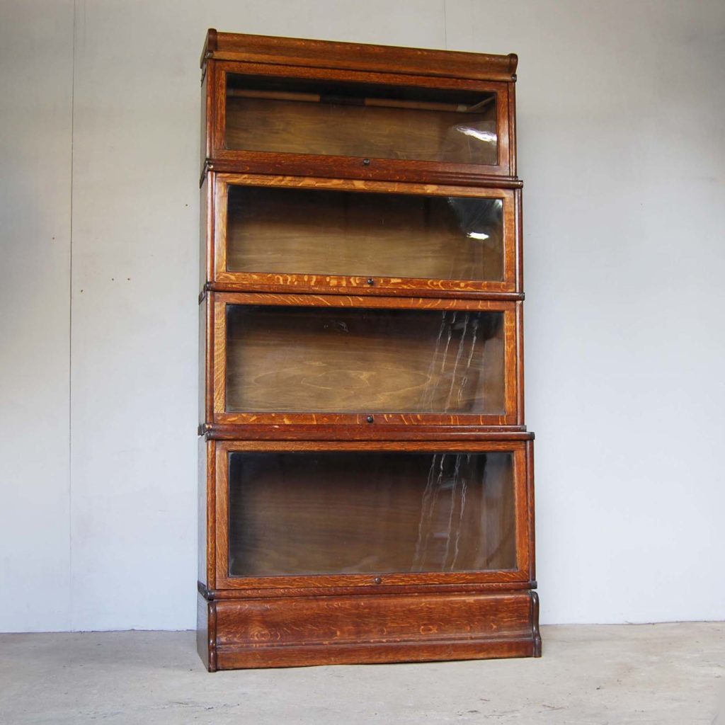 An English oak glazed sectional bookcase,-0