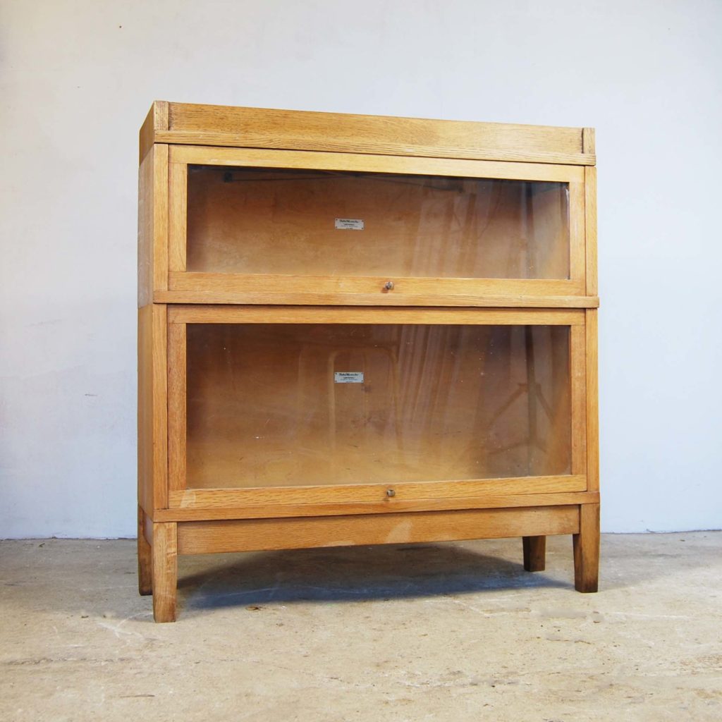 A blonde oak two stage sectional bookcase-0