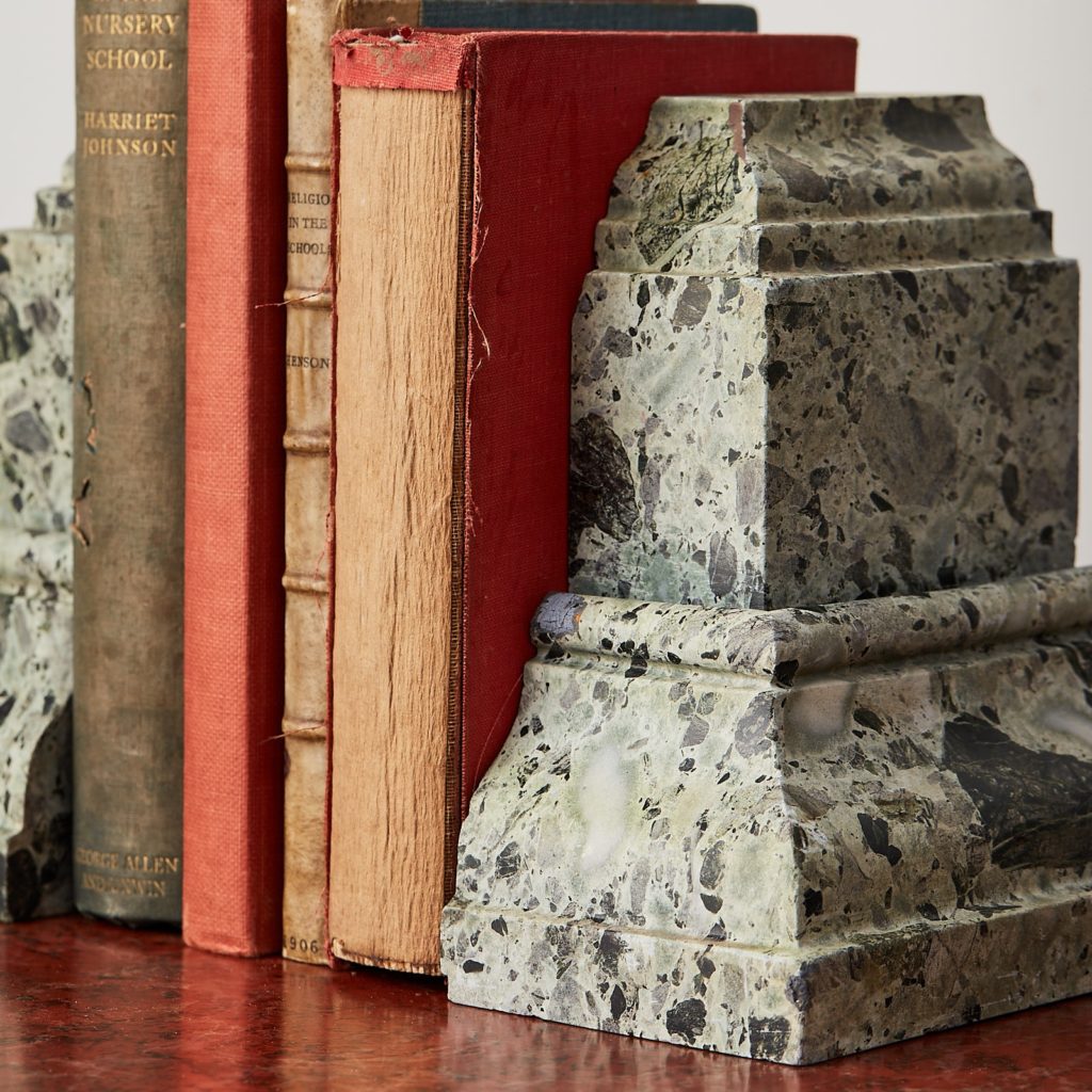 Green verde antico marble bookends with books