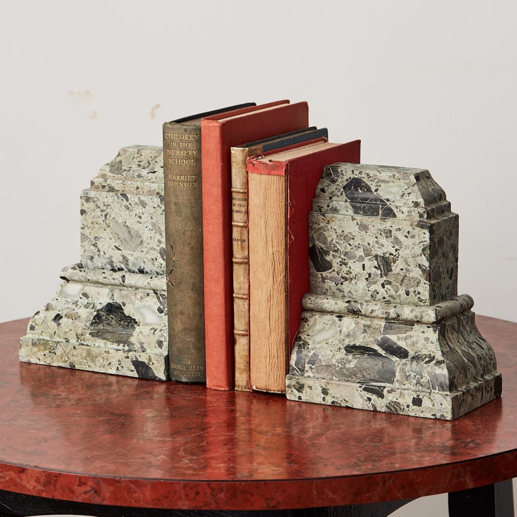 Green verde antico marble bookends with books