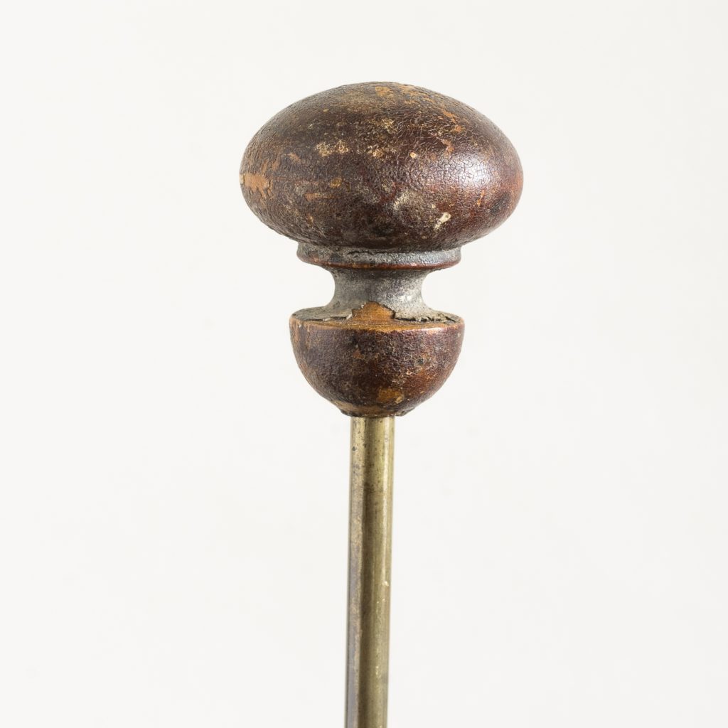 turned timber knob on brass upright