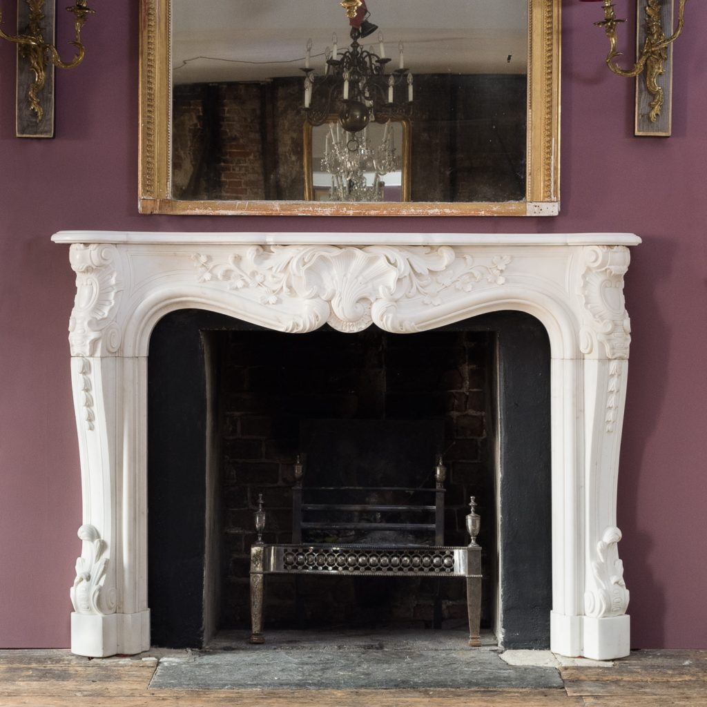 Early nineteenth century English Rococo Statuary marble chimneypiece,