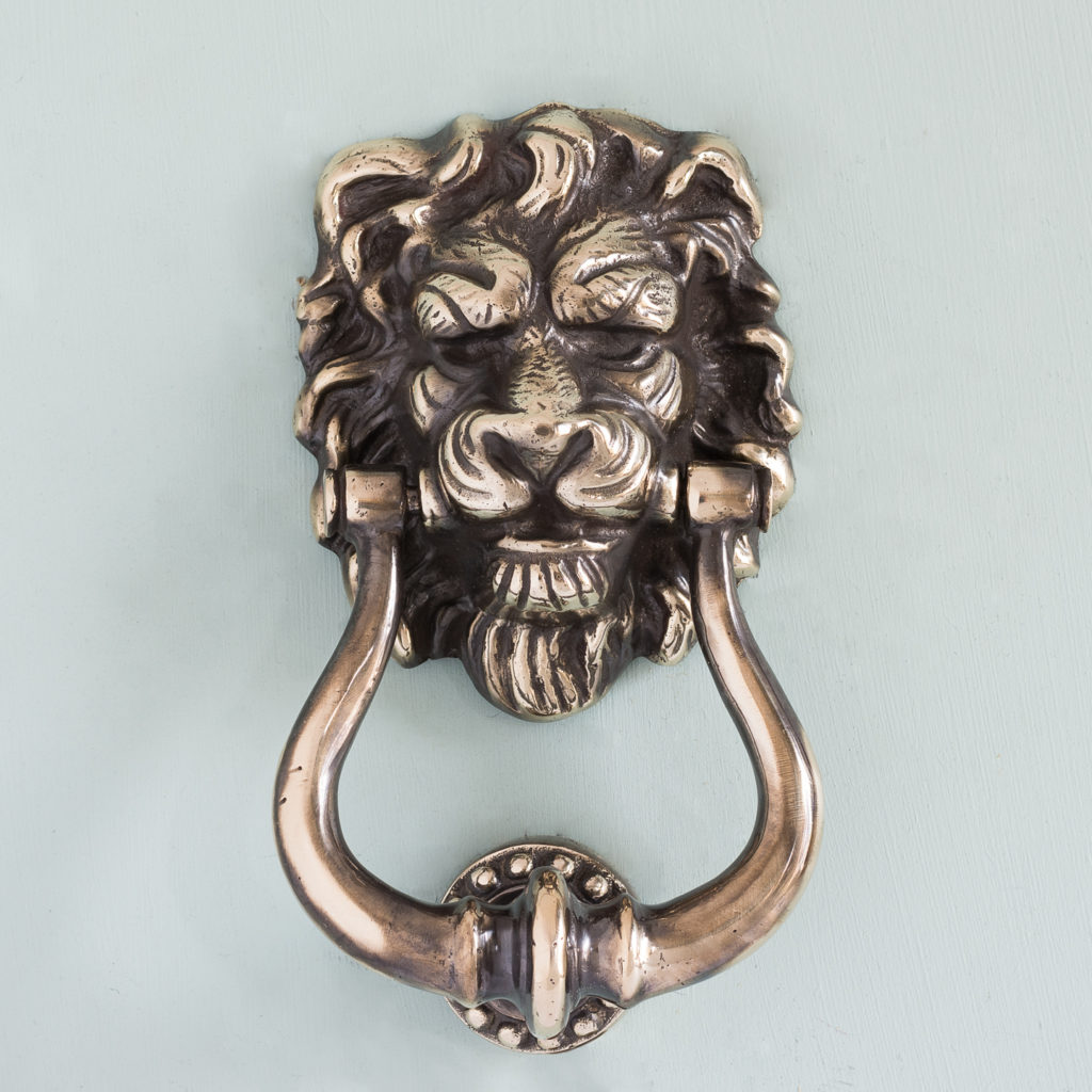 Brass lion's mask door knocker