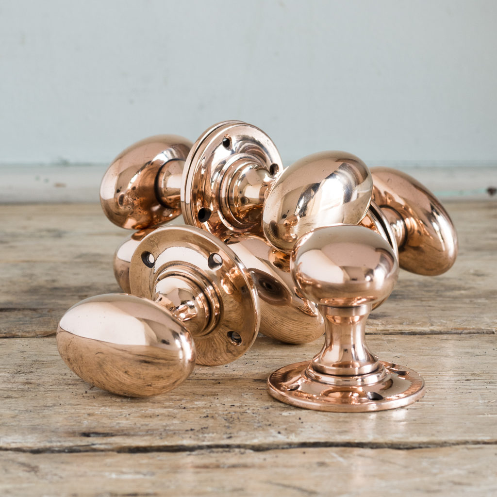 Large early twentieth century oval rose brass door knobs,