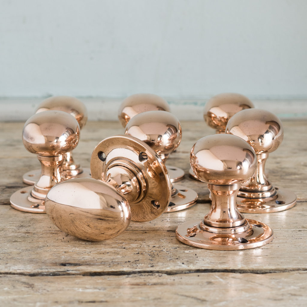 Large early twentieth century oval rose brass door knobs,