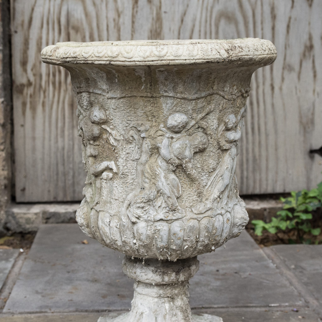 Pair of reconstituted stone Medici urns,