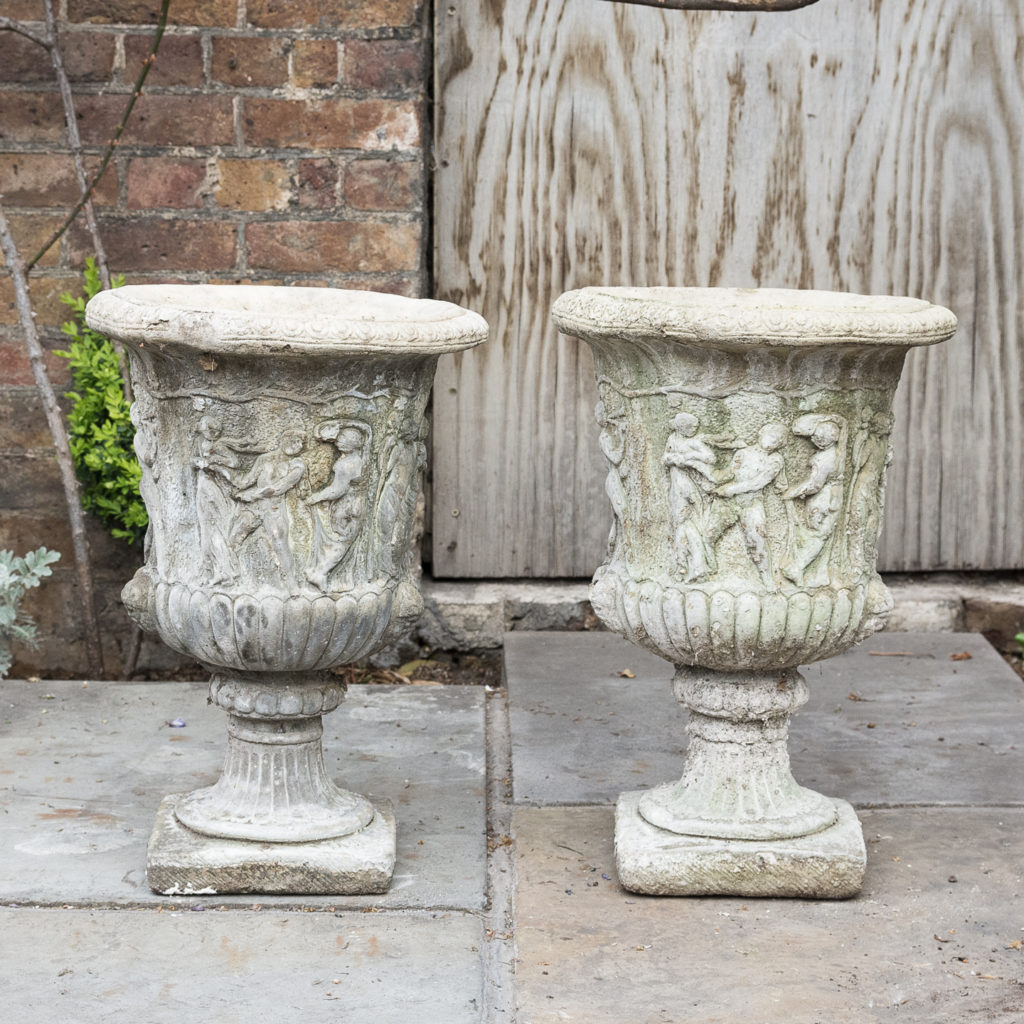 Pair of reconstituted stone Medici urns,