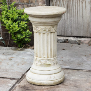 Fluted cast stone pedestal,