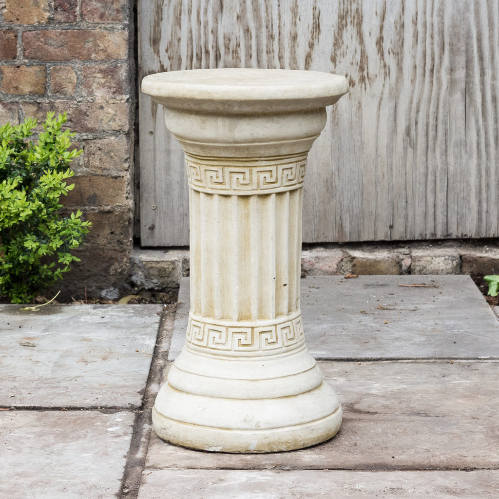 Fluted cast stone pedestal,