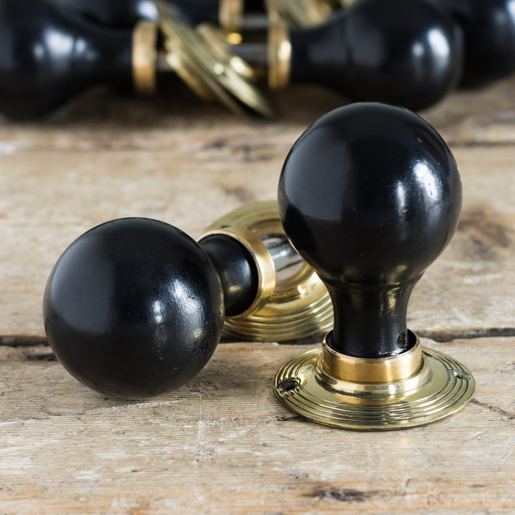 Victorian style spherical ebonised door knobs,
