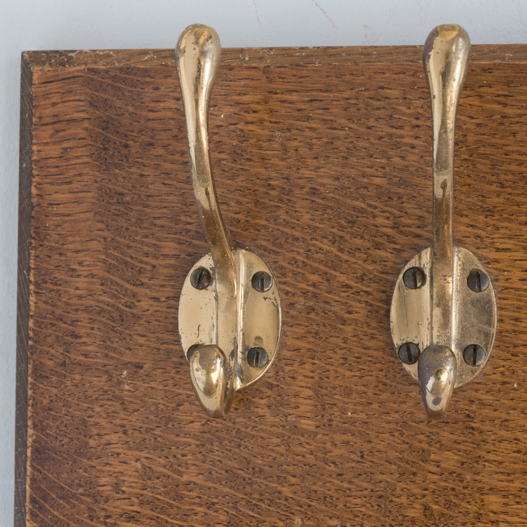 Set of four mounted brass coat hooks,-127334