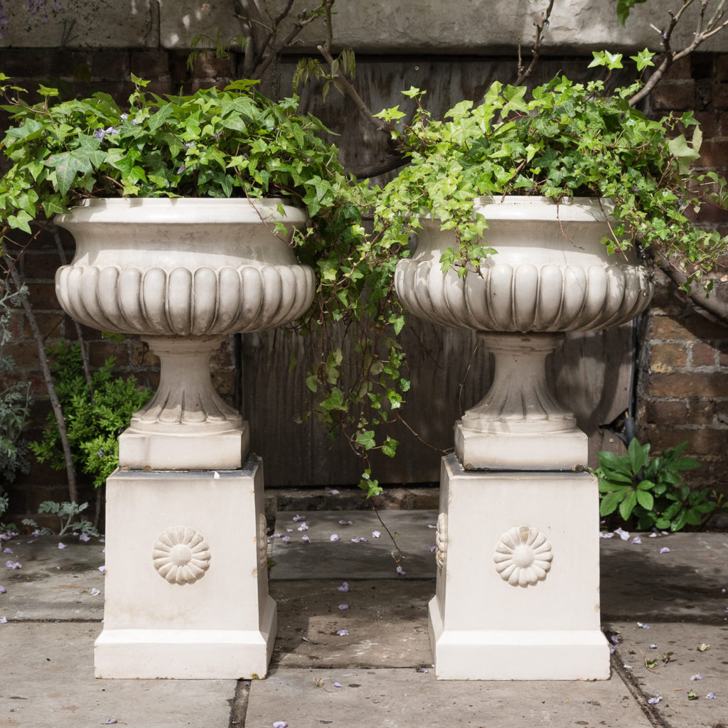 tapered pedestals with foliate motif to each side
