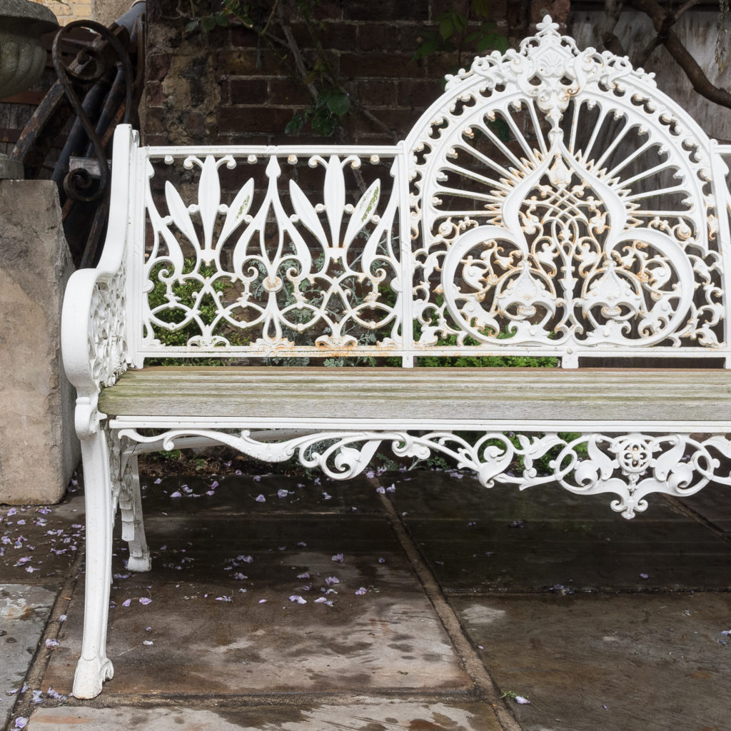 Cast iron garden bench painted white