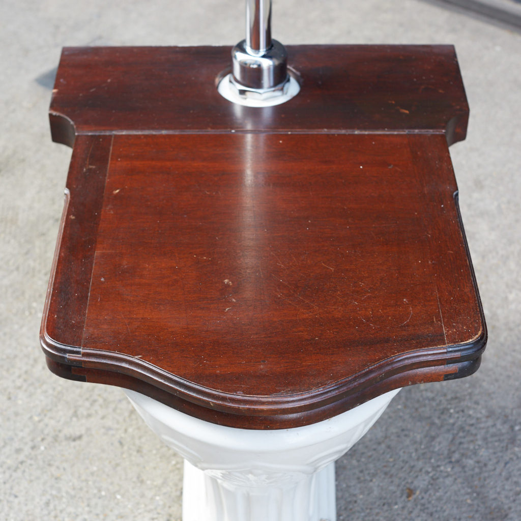 A hinged mahogany lavatory seat, -0