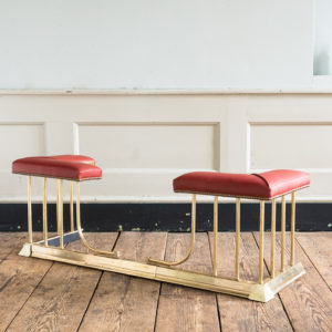 Twentieth century brass and leather upholstered club fender,