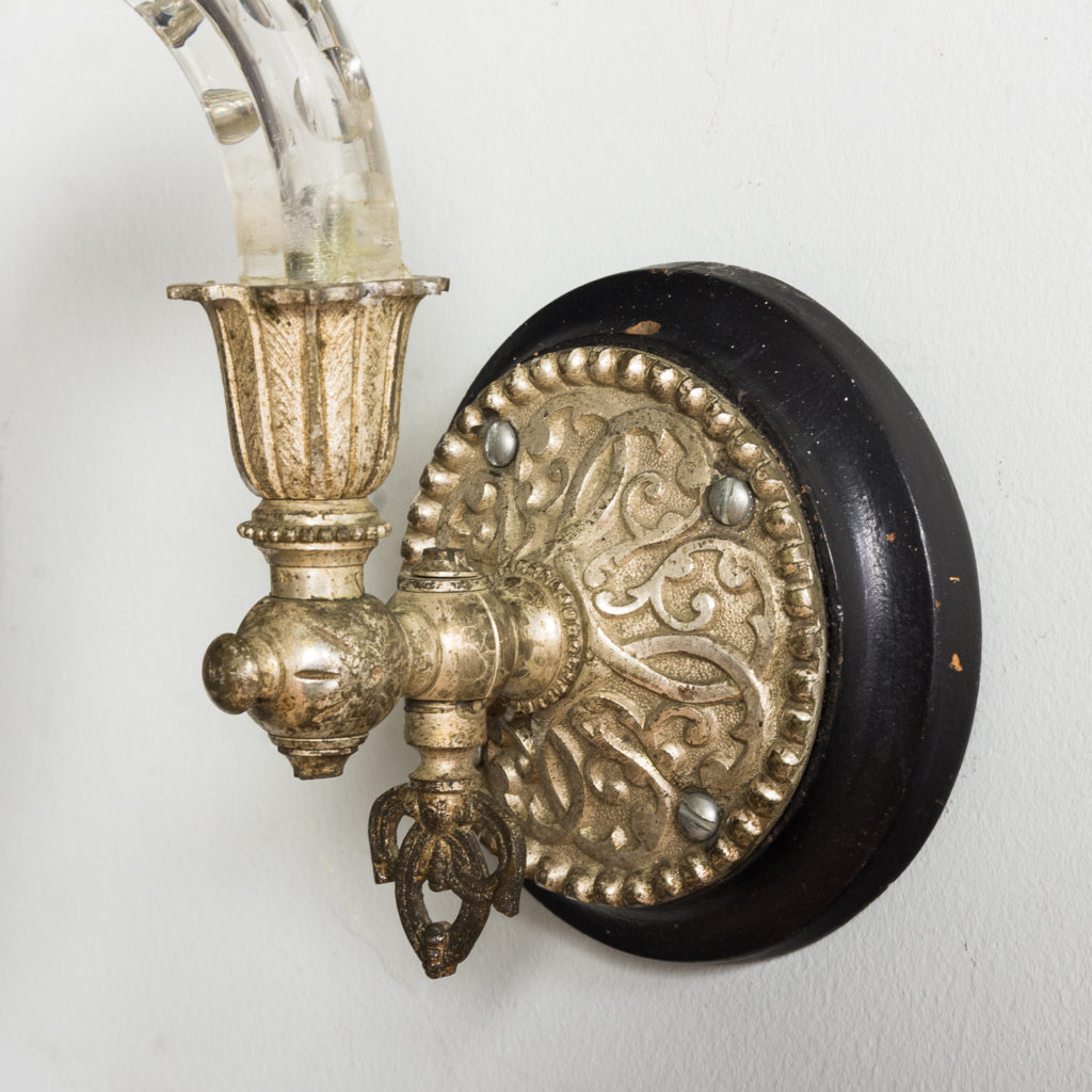 ornate silver-gilt wall mounts and nozzles