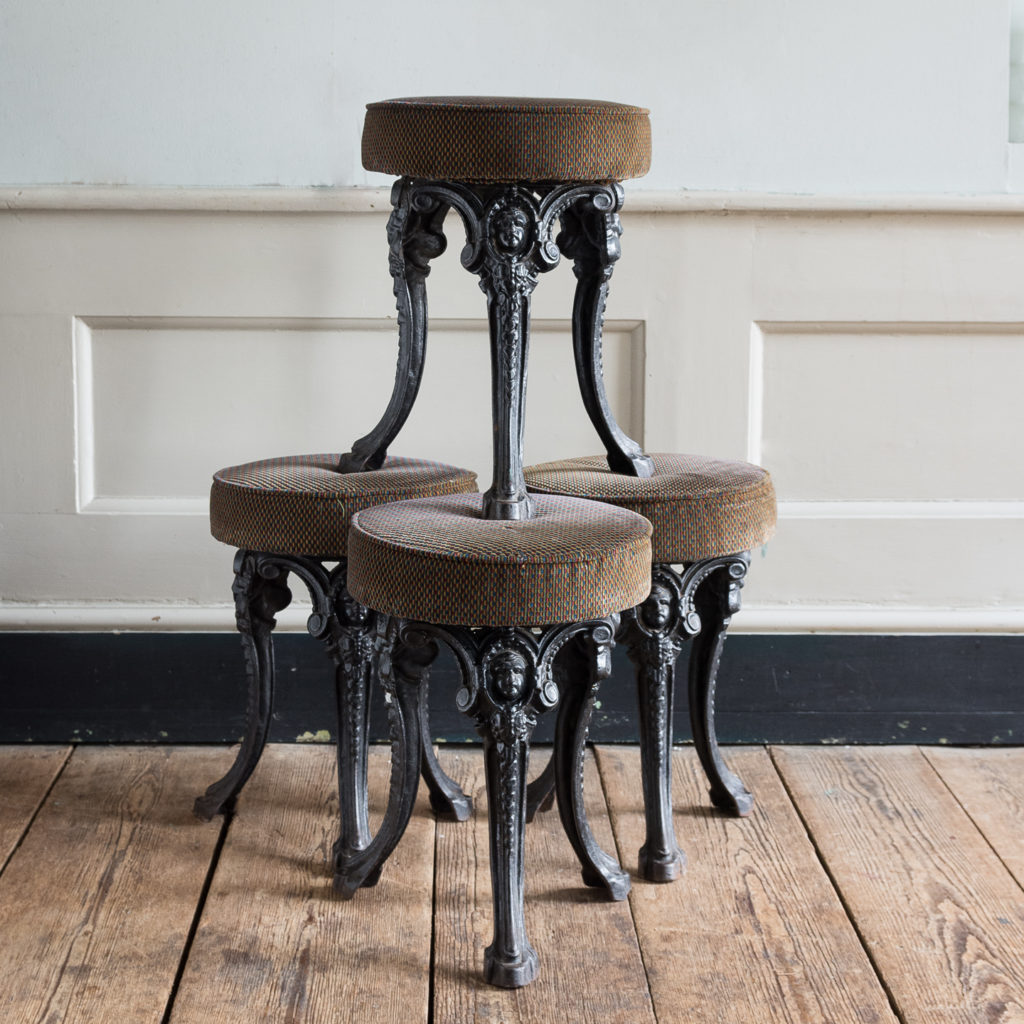 Cast iron pub stools,