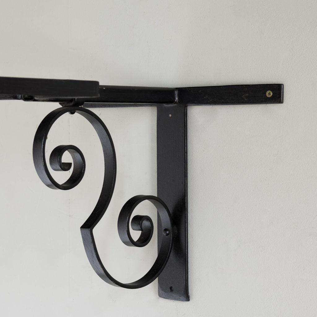 wrought iron bracket with scrolled support