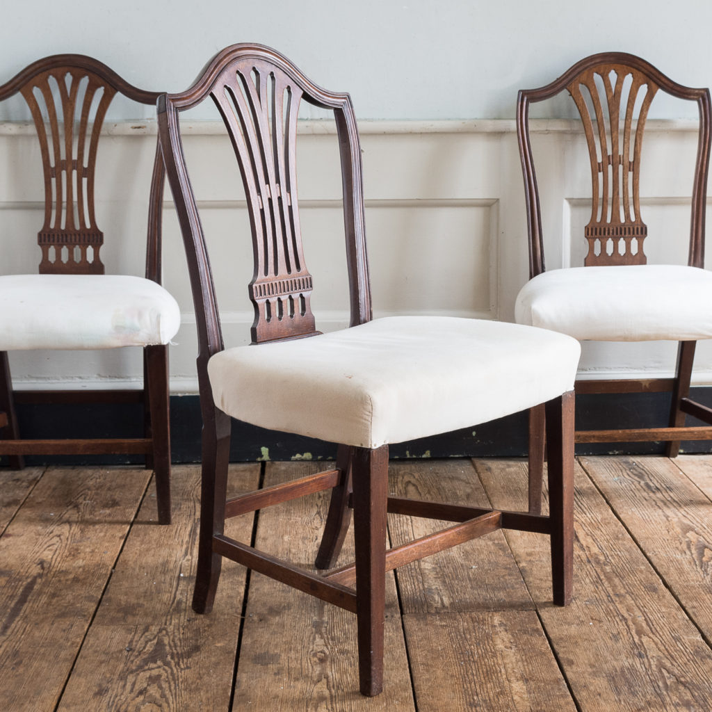 Three George III mahogany dining chairs,