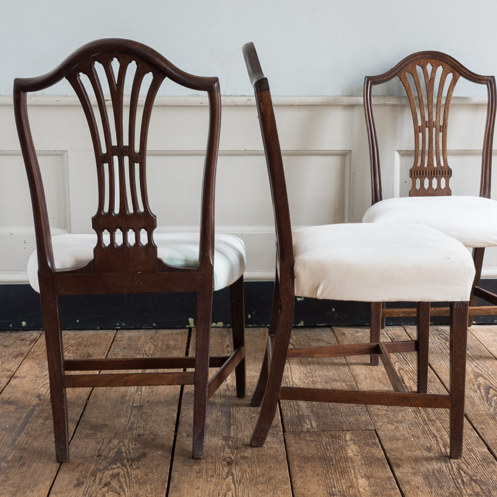 Three George III mahogany dining chairs,