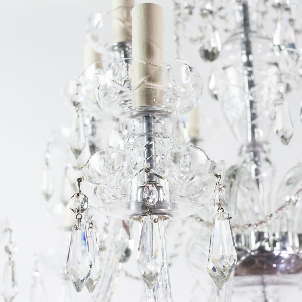 Two twentieth century cut and moulded glass twelve light chandeliers,-131581