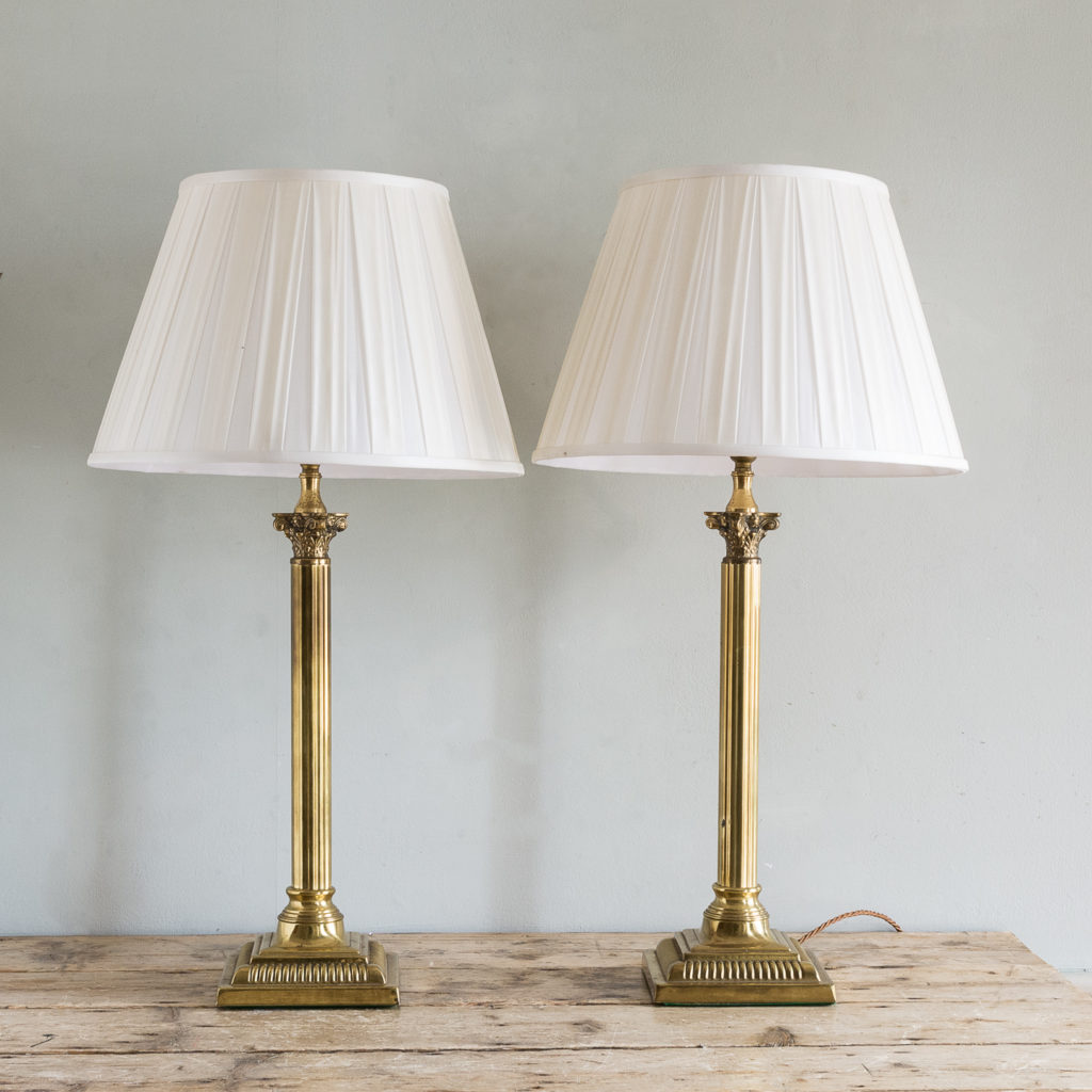 Pair of brass Corinthian column table lamps,