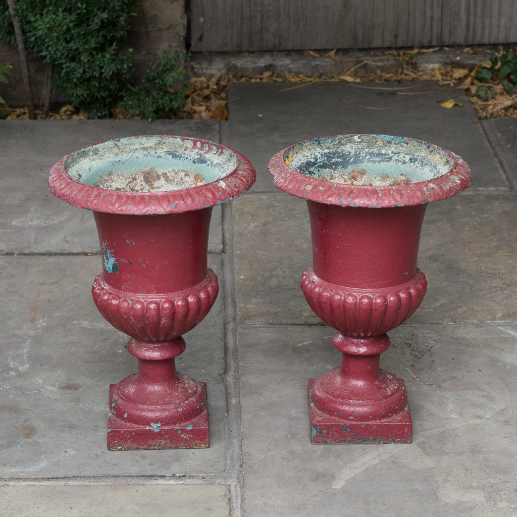 Pair of cast iron campana urns,