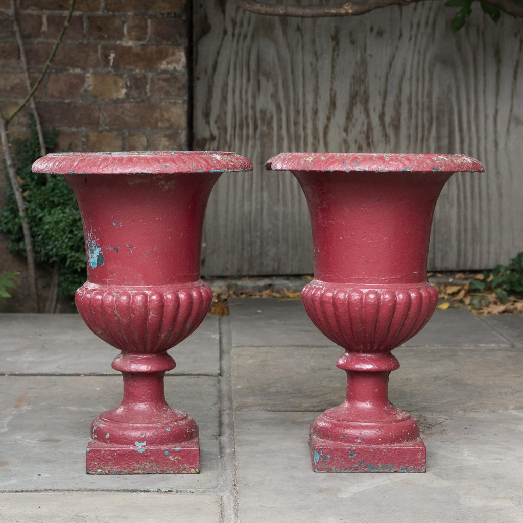 Pair of cast iron campana urns,