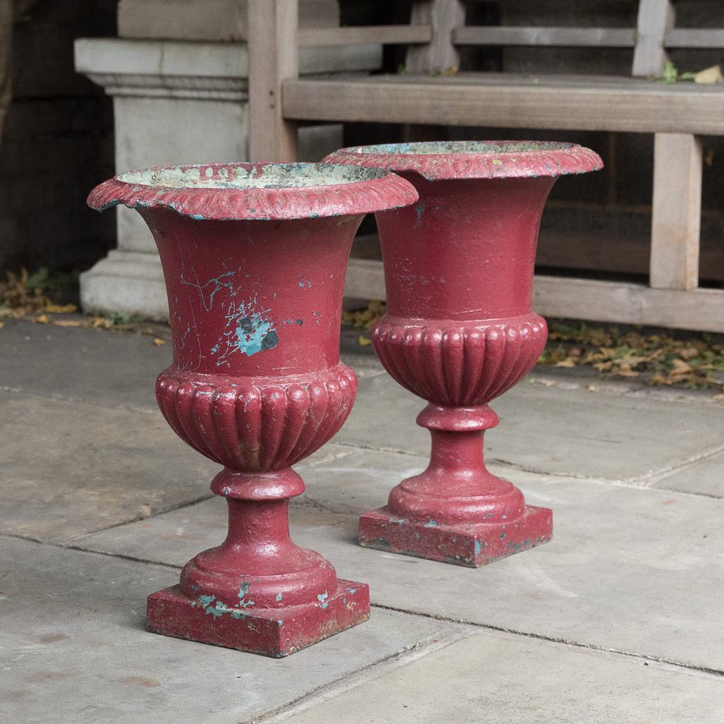 Pair of cast iron campana urns,