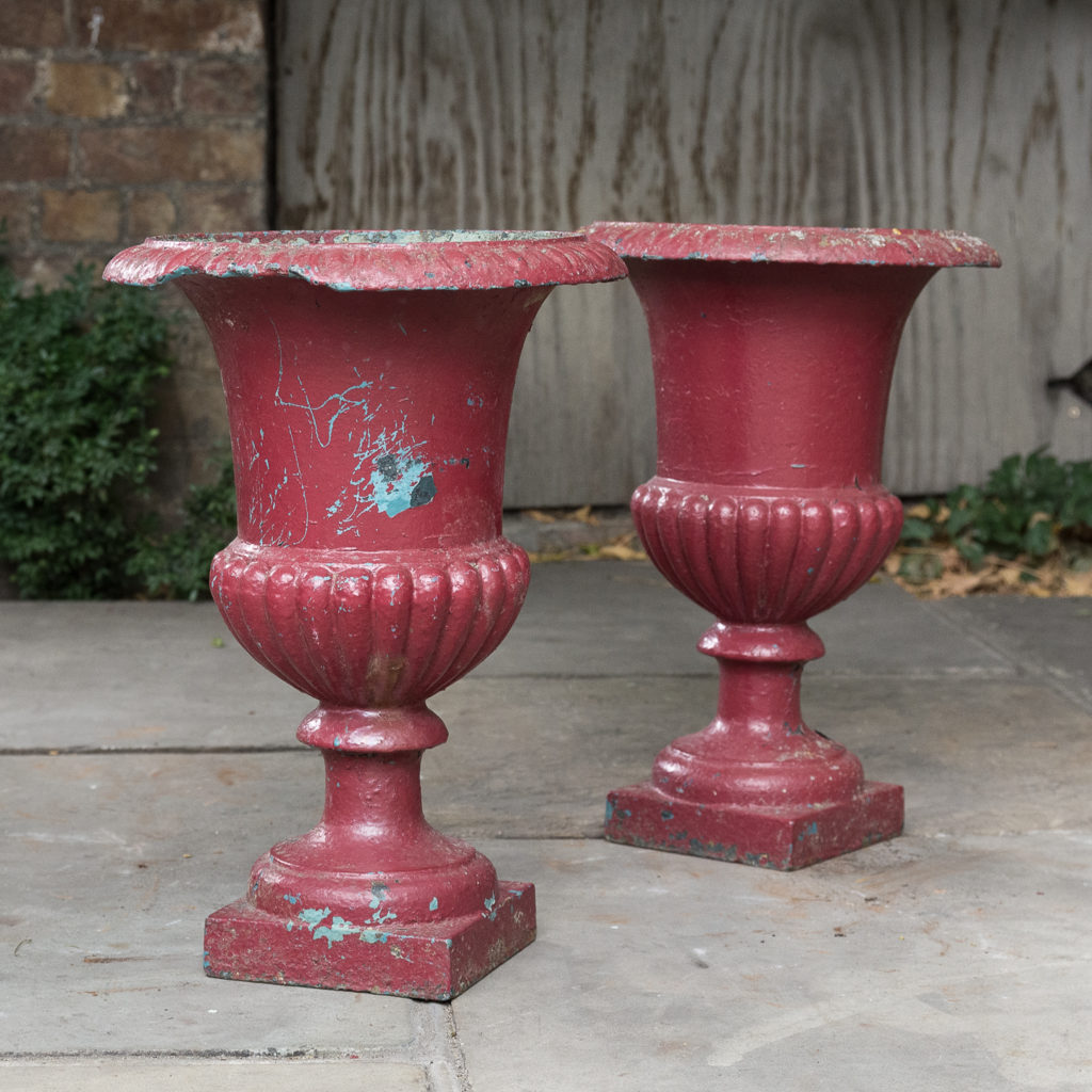 Pair of cast iron campana urns,