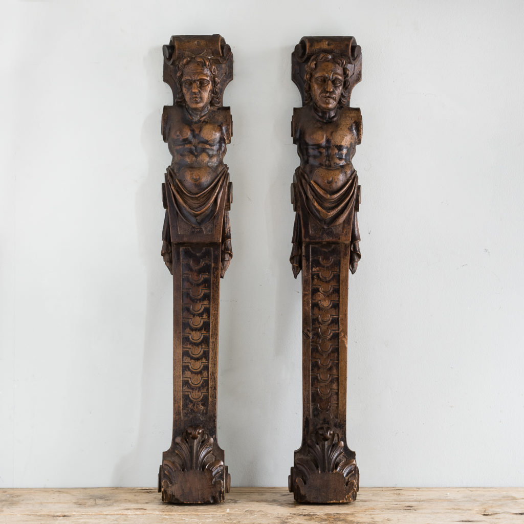 Pair of eighteenth century walnut figural terms,